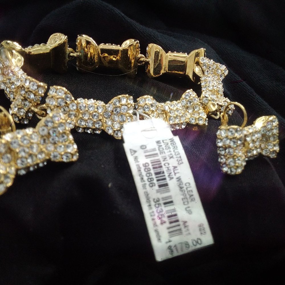 Kate Spade Bracelette and Earring Set. Silver and Gold Bows